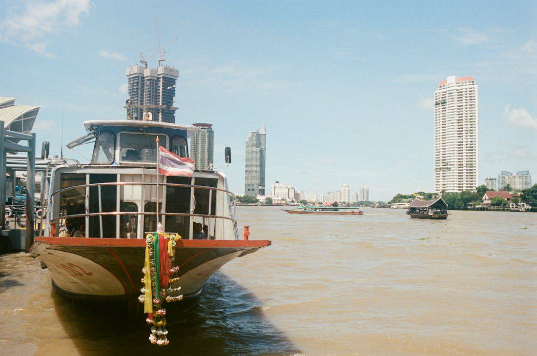Express boat at a pier on the Chao Phraya River in Bangkok