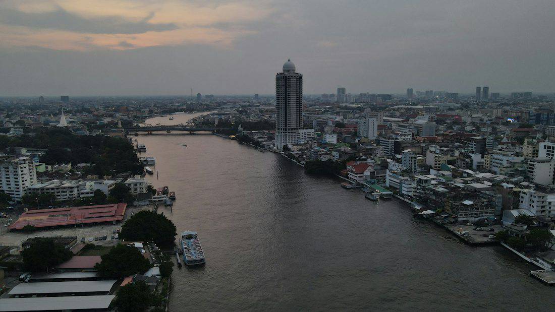 A river with a city in the background.