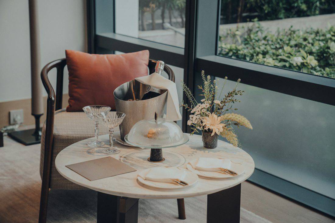 Table set by the window in a Bangkok hotel room