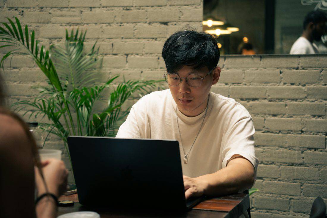 Laptop workspace inside a cafe