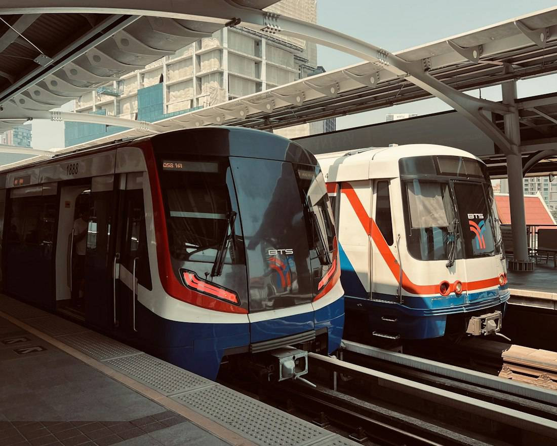 Trains waiting at a Bangkok station platform