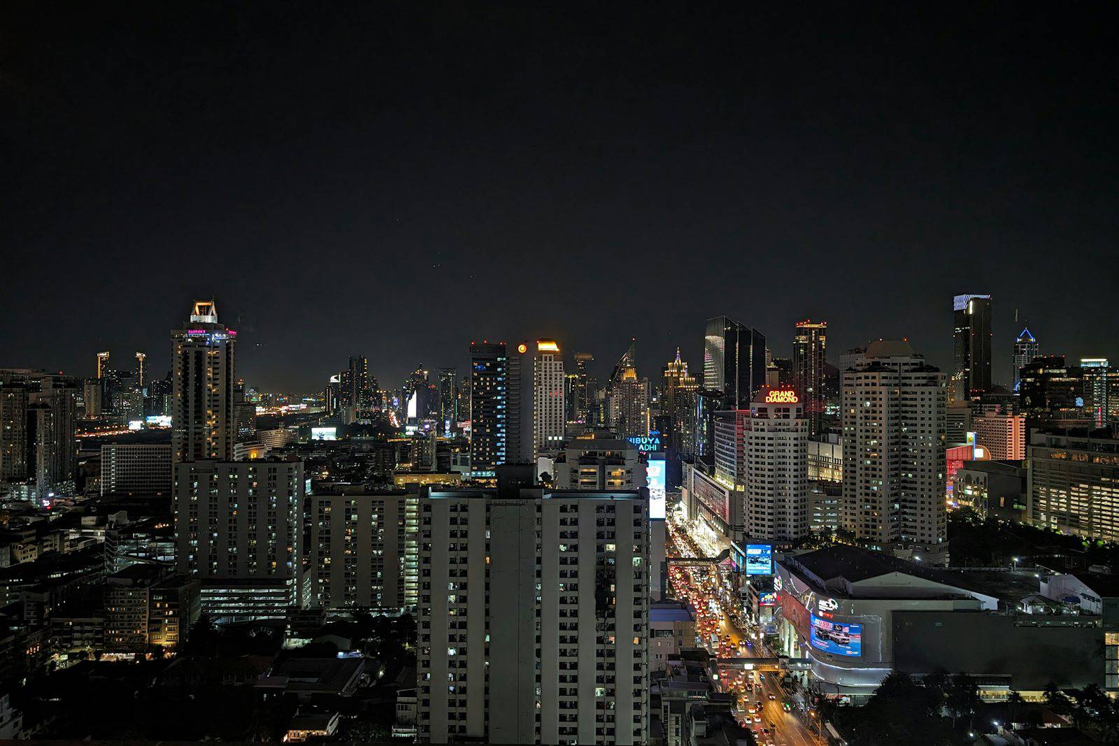 A view of a city at night from the top of a building