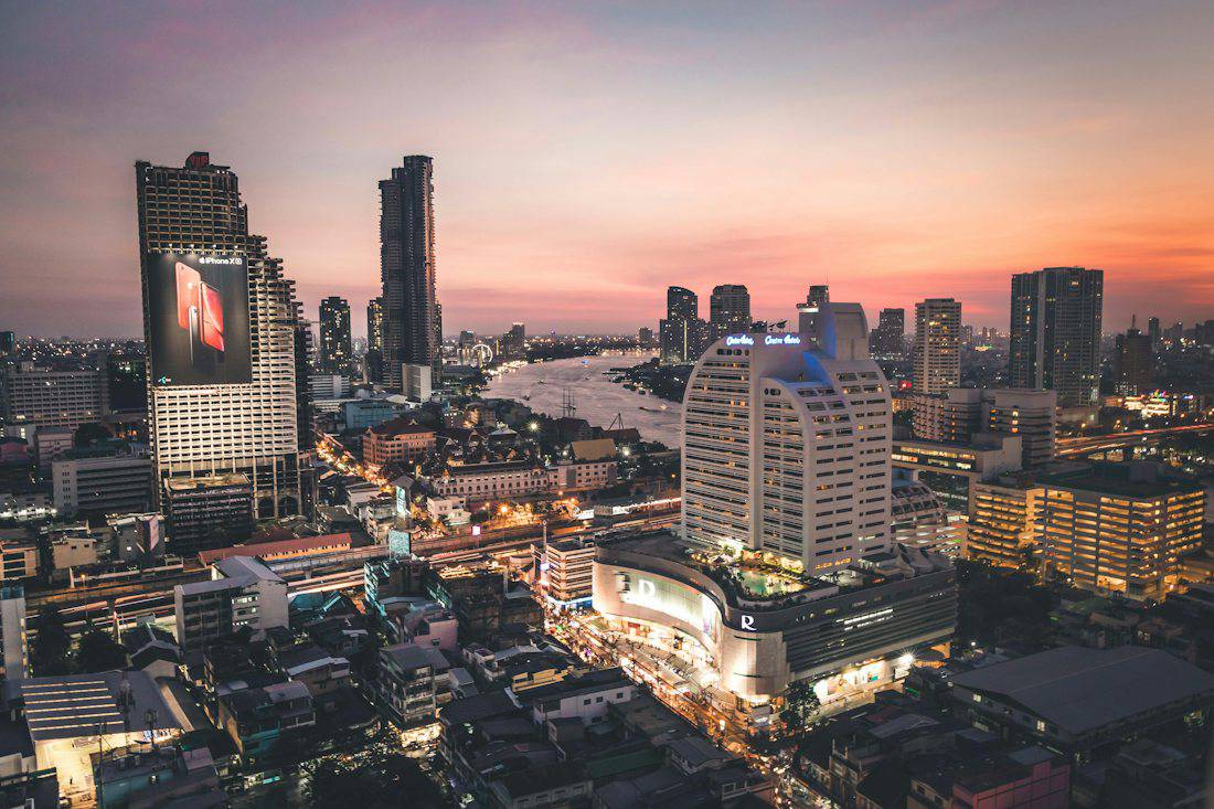 Bangkok riverside skyline at sunset from a rooftop