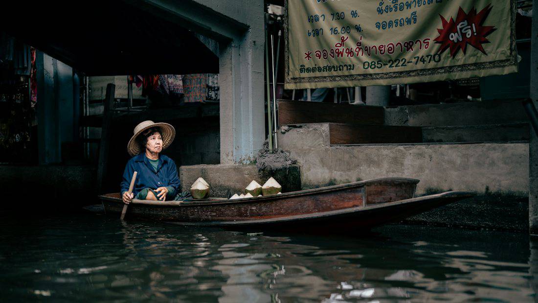 Canal-side food scene at Amphawa floating market