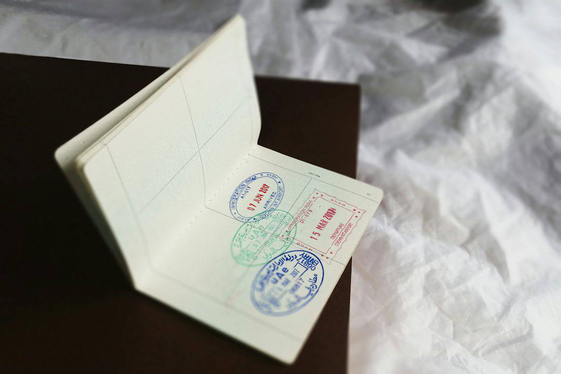 Open passport showing entry and exit stamps