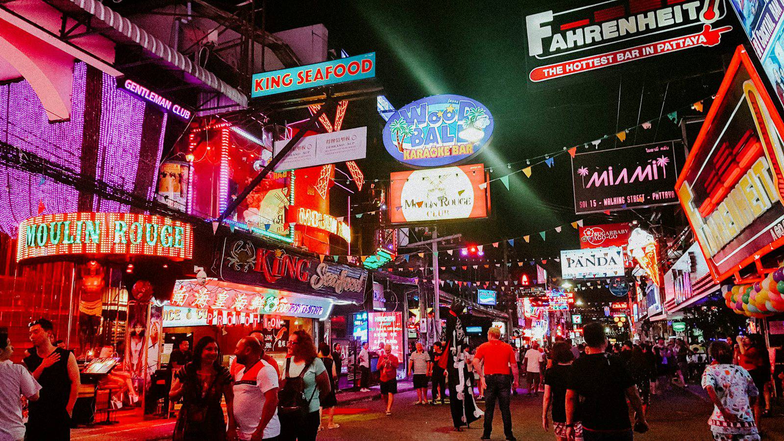Neon signs and crowds on Pattaya Walking Street at night