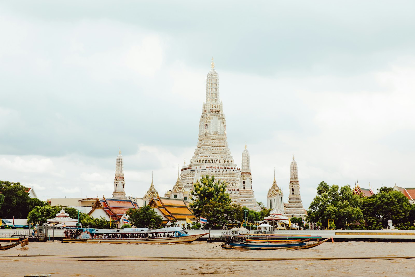 The central prang of Wat Arun rising beside the Chao Phraya river