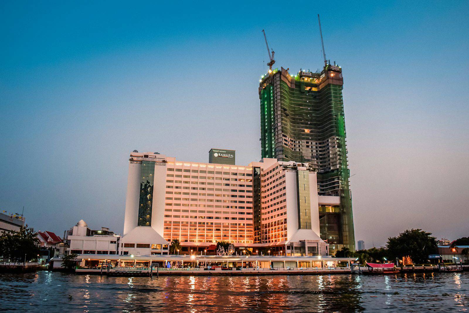Riverside hotel on the Chao Phraya River at dusk